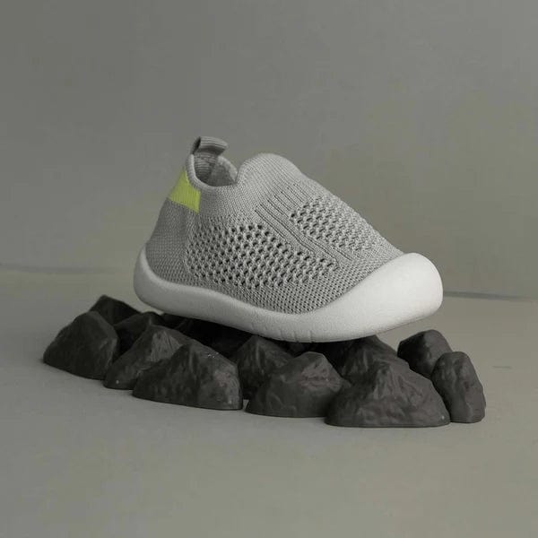 Gray slip-on shoe with a white sole 